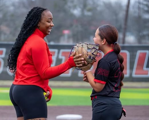 Team Rollin coach and player on the field